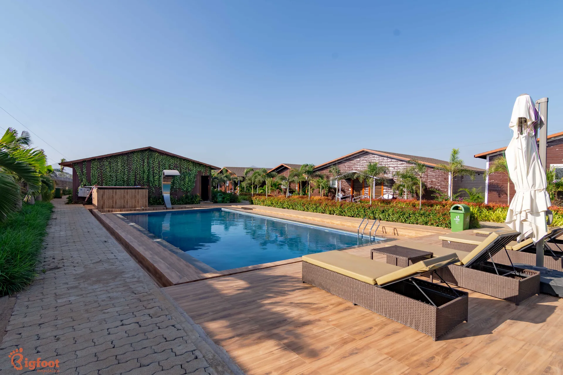 Outdoor swimming pool at Azure Resort near Pawna Lake, Lonavala