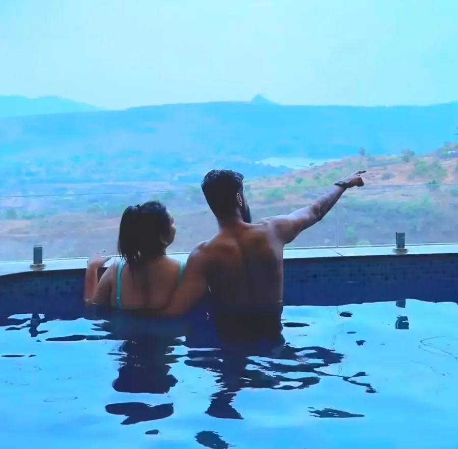 Guests relaxing in their private pool overlooking the Pawna valley at Azure Resort