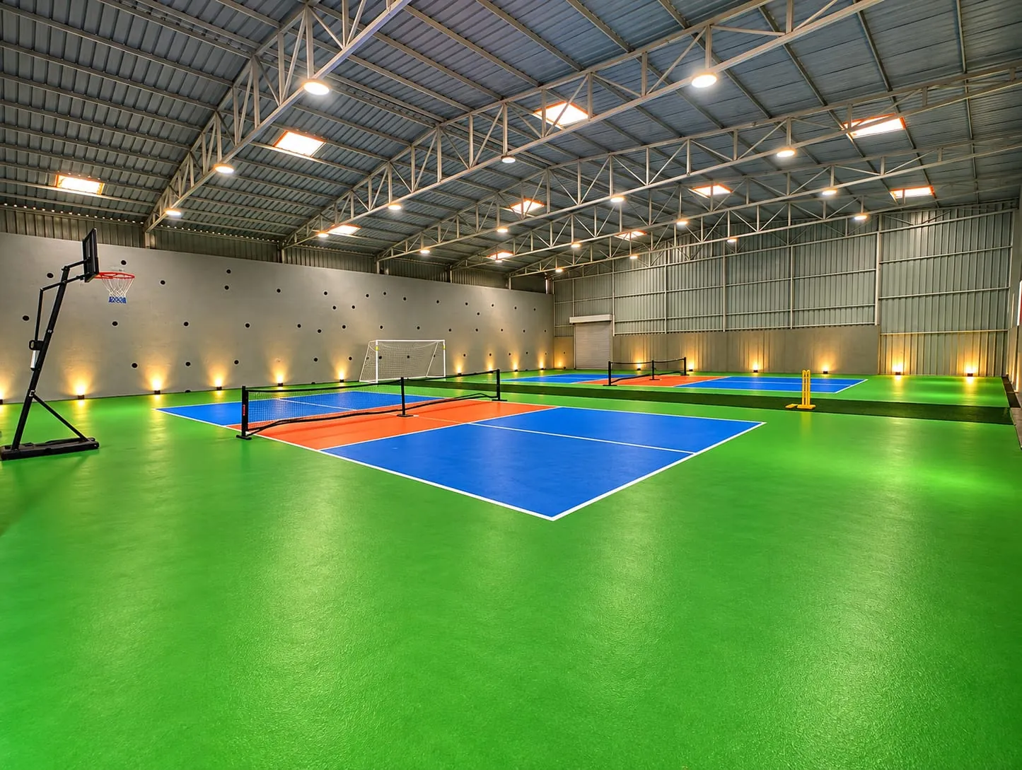Indoor multipurpose sports arena at Azure Resort — pickleball, cricket, football and basketball