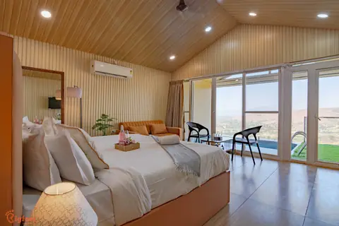 Bedroom with valley-view glass doors