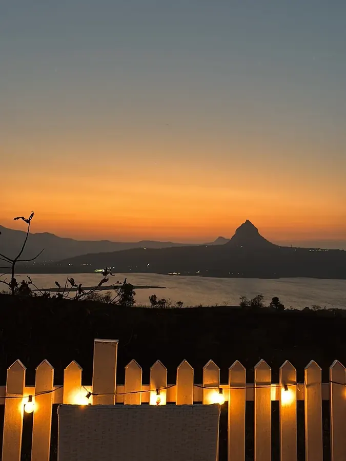 Golden-hour lake view from Sundowner restaurant at Azure Resort